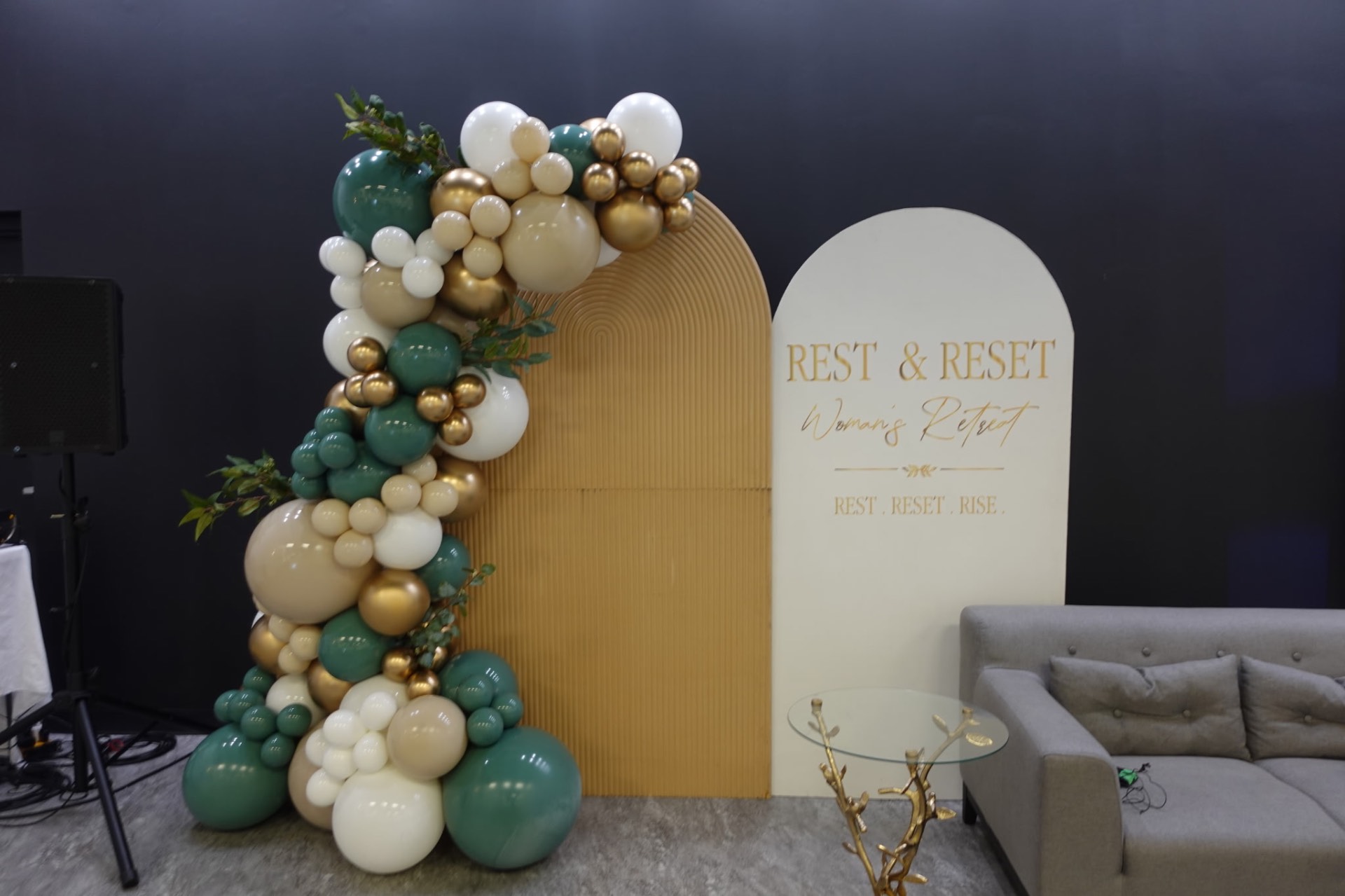 Rest & Reset Women's Retreat arch backdrop with balloon garland